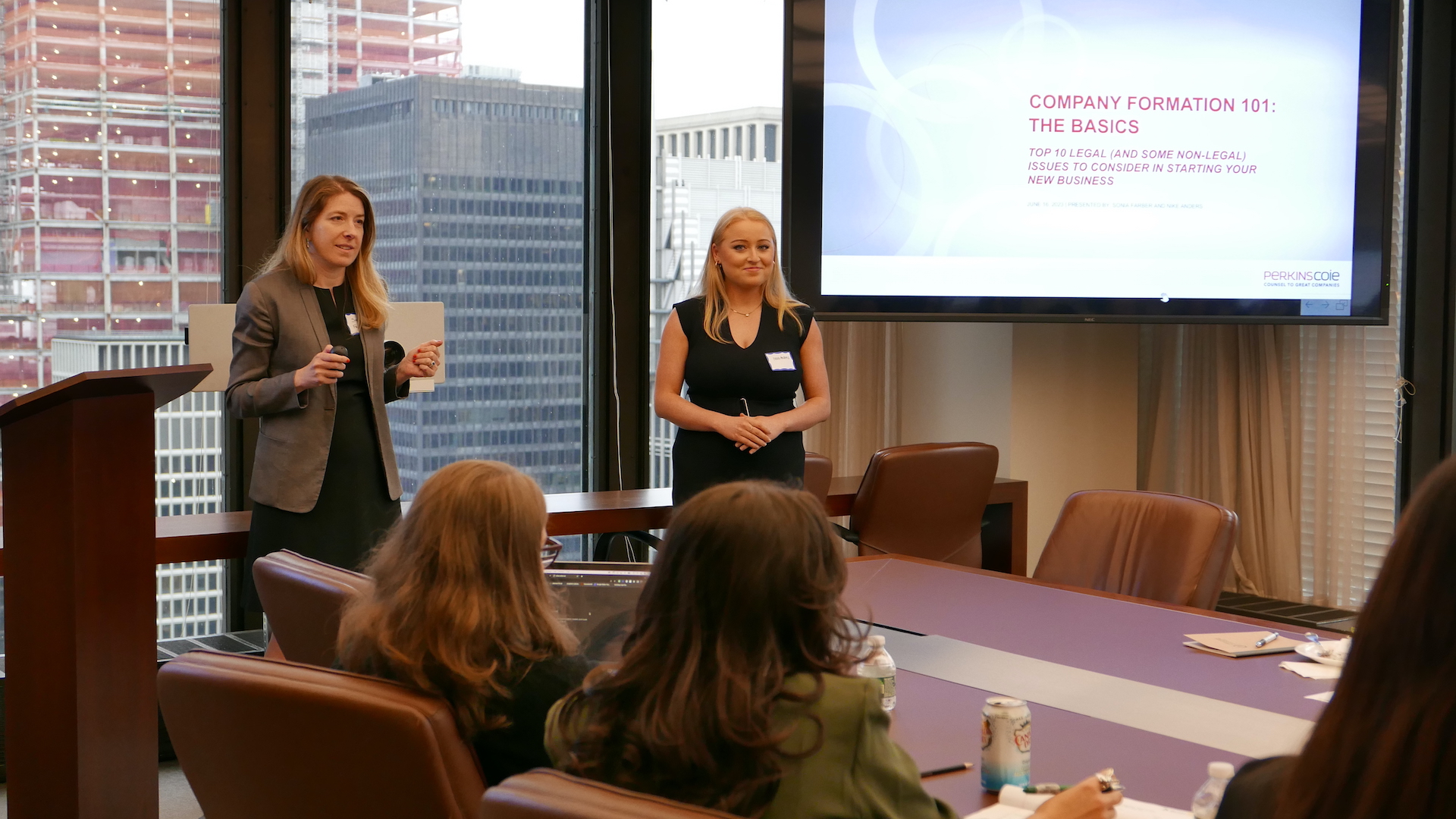 [Image description: 2023 Startup Summit speakers, Sonia Farber and a colleague, address the room of summit participants.]