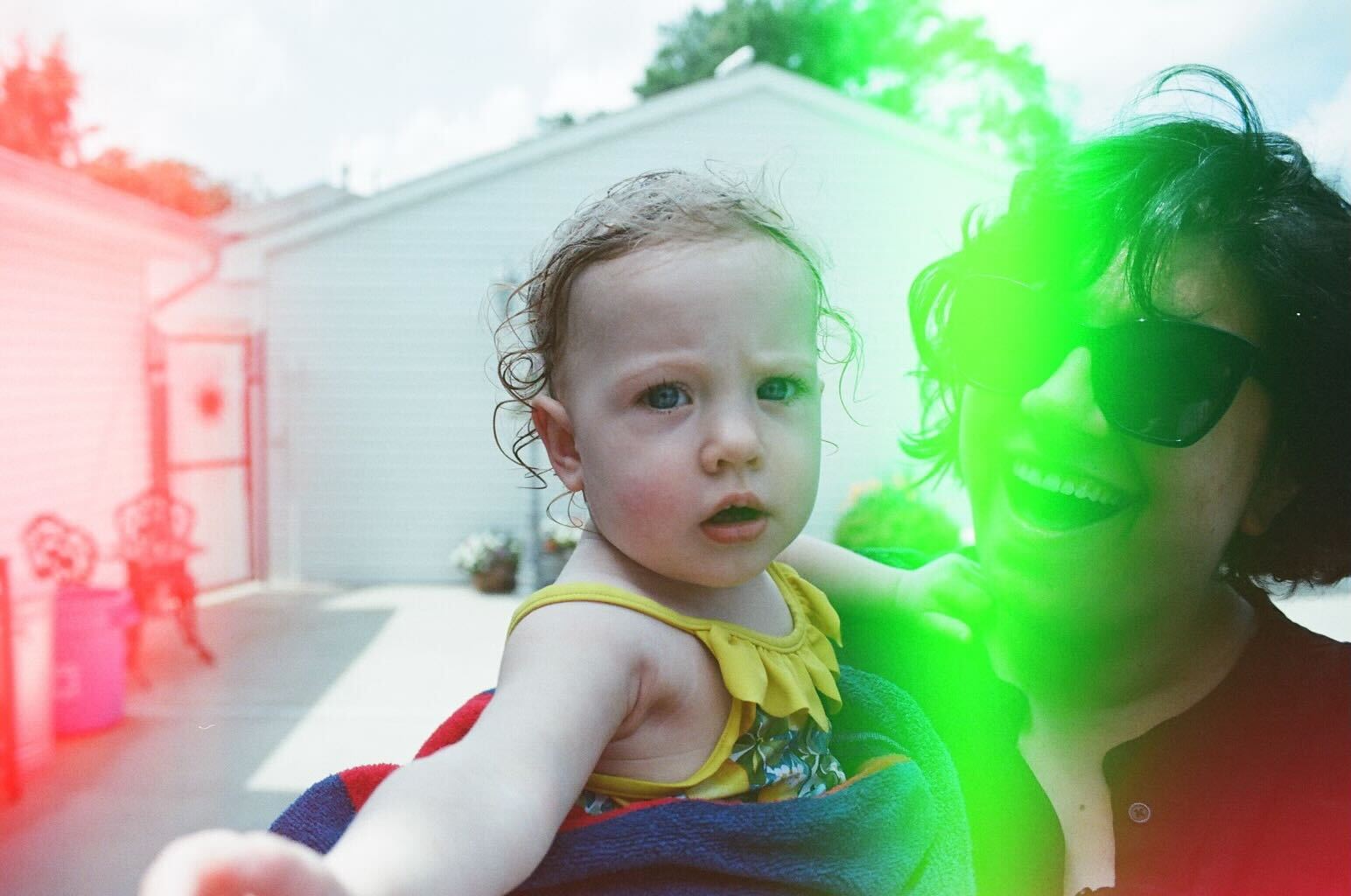 [Image description: Kristin Molloy and her niece. The image has a green lens flair over part of Kristin's face]