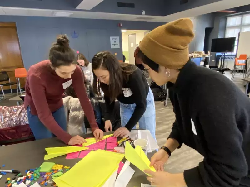 Picture of students at one of the Athena Summer Institutes working on a project